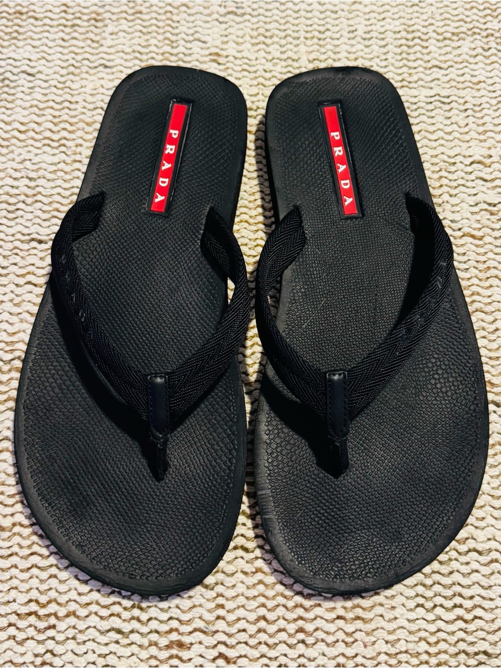 Prada Black Flip-Flop Sandals with Red Logo Accents